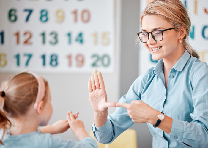 teachersign1 Teacher signing to young child